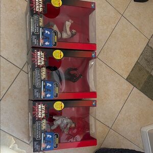 Star Wars Collectible Figures with Red and Black Packaging